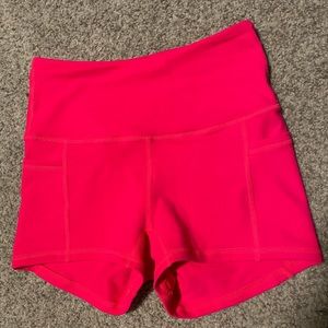 Bright hot neon pink Buffbunny gym workout shorts